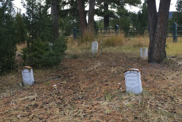 This undated photo provided by the National Park Service shows Fort Yellowstone Cemetery, in Yellowstone National Park, Wyo. A Utah man has pleaded guilty after authorities said he was caught digging in a Yellowstone National Park cemetery in search of hidden treasure. Rodrick Dow Craythorn, 52, of Syracuse, Utah, entered the plea Monday, Jan. 4, 2021, in U.S. District Court in Casper, Wyo., to illegally excavating or trafficking in archaeological resources and to damaging federal property. He could face up to 12 years in prison and $270,000 in fines when sentenced on March 17. Craythorn was searching for a treasure chest containing coins, gold, and other valuables left in the backcountry a decade ago by Santa Fe, New Mexico, art and antiquities dealer Forrest Fenn. (National Park Service via AP)