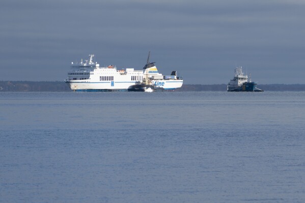 CORRECTS DATE - The passenger ship Marco Polo is pulled from the ground in Djupekas, Sweden, Wednesday, Nov. 1, 2023. The ferry that had ran aground last month off southeastern Sweden, leaking oil into the Baltic Sea, has been pulled free and anchored nearby. The Swedish Coast Guard said Wednesday that a new oil leak had also been discovered. (Ola Torkelsson/TT News Agency via AP)