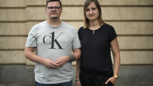 Teachers Laura Nickel, right, and Max Teske pose for a photograph after an interview with The Associated Press in Cottbus, Germany, Wednesday, July 19, 2023. Two teachers in eastern Germany tried to counter the far-right activities of students at their small town high school. Disheartened by what they say was a lack of support from fellow educators, Laura Nickel and Max Teske decided to leave Mina Witkojc School in Burg. (AP Photo/Markus Schreiber)