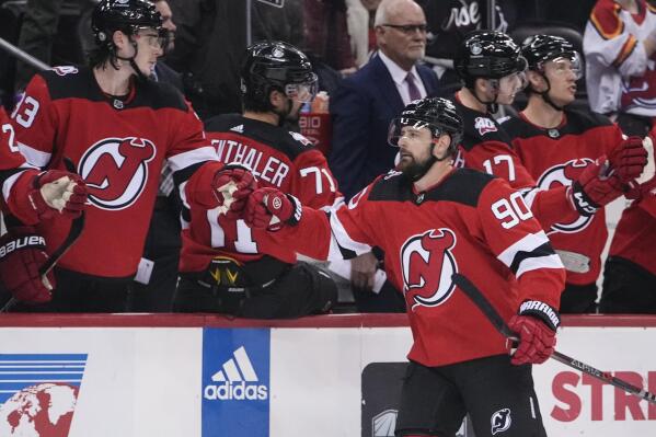 New Jersey Devils' Tomas Tatar (90) is congratulated for his goal against the Winnipeg Jets during the first period of an NHL hockey game Sunday, Feb. 19, 2023, in Newark, N.J. (AP Photo/Frank Franklin II)