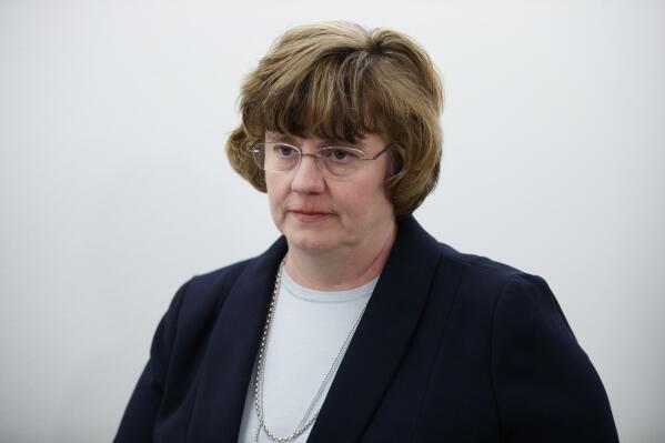 FILE - Phoenix prosecutor Rachel Mitchell returns to a Senate Judiciary Committee hearing after a break on Capitol Hill in Washington on Sept. 27, 2018. The Maricopa County Board of Supervisors on Wednesday, April 20, 2022, chose one of the three Republicans running to replace former County Attorney Allister Adel to temporarily fill her post, a move that gives longtime prosecutor Rachel Mitchell incumbent status and leg up in August's GOP primary. (AP Photo/Carolyn Kaster, File)
