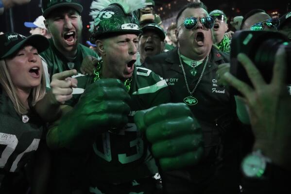 New York Jets fans cheer during the first round of the NFL football draft, Thursday, April 27, 2023, in Kansas City, Mo. (AP Photo/Charlie Riedel)