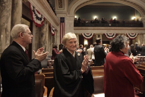 FILE - Members of the Wisconsin State Supreme Court, including Justice David Prosser, Jr., left, Justice Patience Roggensack, center, and Chief Justice Shirley Abrahamson, right, gather for Governor Scott Walker's state budget address at the Wisconsin State Capitol in Madison, Wis. Wednesday, Feb. 20, 2013. A Wisconsin judge on Friday, Nov. 10 ordered the former chief justice of the Wisconsin Supreme Court to produce records related to her work advising the Republican Assembly speaker on whether to impeach a current justice.(AP Photo/Wisconsin State Journal, John Hart, File)