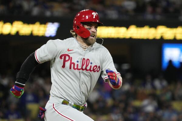 Philadelphia Phillies' Bryce Harper heads to first as he grounds out during the fourth inning of a baseball game against the Los Angeles Dodgers Tuesday, May 2, 2023, in Los Angeles. (AP Photo/Mark J. Terrill)