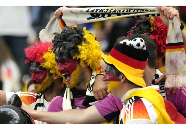  Fans shout before a Group A match between Switzerland and Germany at the Euro 2024 soccer tournament in Frankfurt, Germany, Sunday, June 23, 2024. (AP Photo/Themba Hadebe)