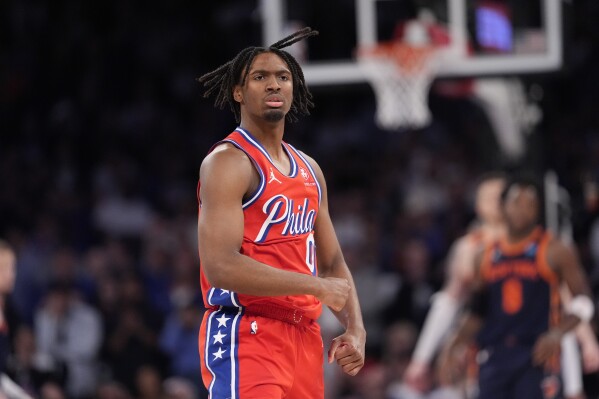 Philadelphia 76ers' Tyrese Maxey (0) gestures after making a 3-point basket during the second half of Game 2 in an NBA basketball first-round playoff series against the New York Knicks, Monday, April 22, 2024, in New York. (AP Photo/Frank Franklin II)