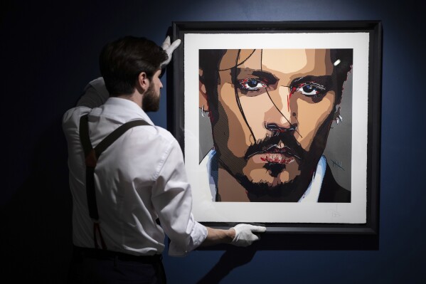 A self-portrait by actor Johnny Depp is displayed at Castle Fine Art gallery on Thursday, July 20, 2023 in London. Depp has painted the emotions of recent years into a self-portrait, titled "Five," and is offering the result for sale as a time-limited edition as of July 20, 2023. (Scott Garfitt/Invision/AP)