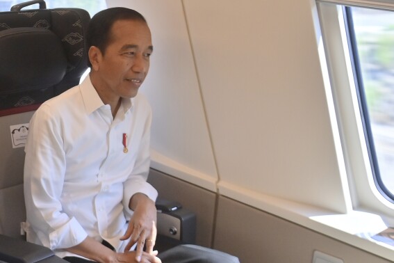Indonesian President Joko Widodo sits inside of high-speed railway during a test ride in Jakarta, Indonesia, Wednesday, Sept. 13, 2023. Indonesia's President took a test ride Wednesday on Southeast Asia's first high-speed railway as a key project under China's Belt and Road infrastructure initiative. (Akbar Nugroho Gumay/Pool Photo via AP)