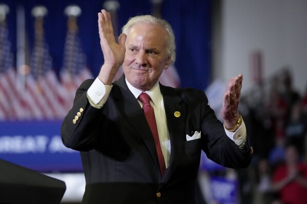 South Carolina Gov. Henry McMaster claps before Republican presidential candidate former President Donald Trump speaks at a Get Out The Vote rally at Coastal Carolina University in Conway, S.C., Saturday, Feb. 10, 2024. (AP Photo/Manuel Balce Ceneta)