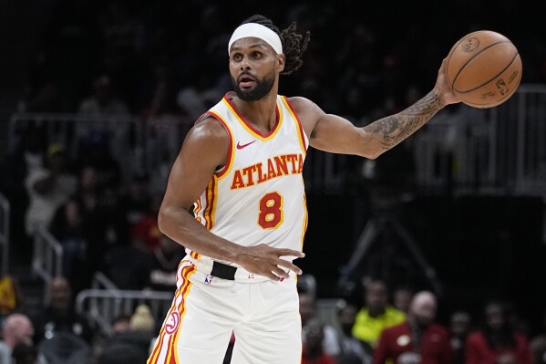 FILE -A tlanta Hawks guard Patty Mills (8) plays against the Cleveland Cavaliers during the first half of a preseason NBA basketball Tuesday, Oct. 10, 2023, in Atlanta. Veteran point guard Patty Mills has agreed to sign with the Miami Heat for the remainder of the season, a person with knowledge of the deal said Tuesday, March 5, 2024.(AP Photo/John Bazemore, File)
