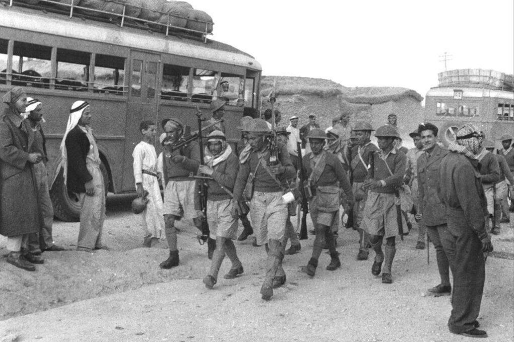 Egyptian volunteer soldiers, who entered southern Palestine in early May to join forces fighting against the Jews, are shown with guns during training maneuvers in May 1948.  (AP Photo)