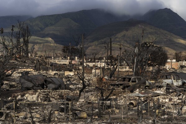 FILE - A general view shows the aftermath of a wildfire in Lahaina, Hawaii, Aug. 21, 2023. Hawaii Gov. Josh Green is announcing the creation of a $150 million fund to help those who lost family members or who were injured in Maui’s wildfires. The governor's office says beneficiaries will receive payments of more than $1 million as early as the April-June quarter of next year. (AP Photo/Jae C. Hong, File)