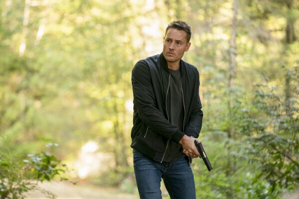 This image released by CBS shows Justin Hartley, as Colter Shaw, in a scene from "Tracker," premiering Feb. 11. (Michael Courtney/CBS via AP)