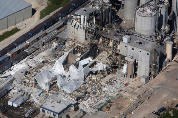 FILE - Part of the Didion Milling Plant in Cambria, Wis., lies in ruins following an explosion in this June 1, 2017 photo. The milling company has agreed to pay $940,000 to settle allegations of multiple violations at a plant that was the scene of a fatal explosion six years ago. The Justice Department announced the settlement Wednesday, Aug. 9, 2023. (John Hart/Wisconsin State Journal via AP, File)