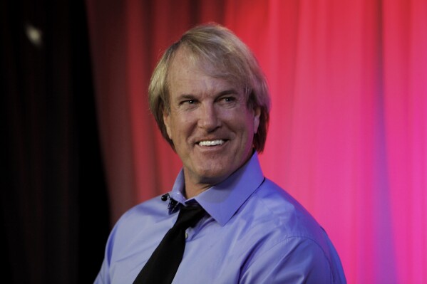John Tesh is interviewed in Los Angeles Monday, April 9, 2012. (AP Photo/Reed Saxon, File)