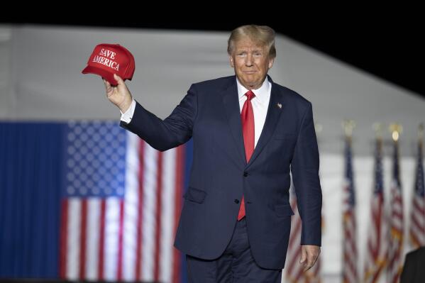 FILE - Former President Donald Trump makes his entrance at a rally at the Minden Tahoe Airport in Minden, Nev.,  Oct. 8, 2022. (AP Photo/José Luis Villegas, File)