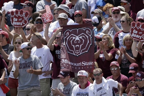 FILE - Fans hold Missouri State flags during a tournament in Fayetteville, Ark., Sunday, June 7, 2015. Missouri State is moving up to the highest tier of Division I college football and joining Conference USA in 2025. (AP Photo/Danny Johnston, File)