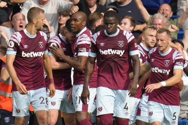 West Ham players celebrate after scores a disallowed goal during the English Premier League soccer match between Chelsea and West Ham United at Stamford Bridge Stadium in London, Saturday, Sept. 3, 2022. (AP Photo/Kirsty Wigglesworth)