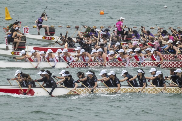 Competitors take part in the Stanley International Dragon Boat Championships to celebrate the Dragon Boat Festival in Hong Kong, Saturday, May 31, 2025. (AP Photo/Chan Long Hei)