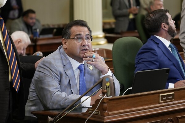 FILE - Assemblyman James Ramos, D-Highlands, watches as votes are posted on a gun control measure at the Capitol in Sacramento, Calif., Tuesday, Aug. 30, 2022. Ramos, introduced legislation this year to require state audits of the progress of University of California and California State University campuses in returning Native American remains and cultural artifacts to tribes. (AP Photo/Rich Pedroncelli,File)