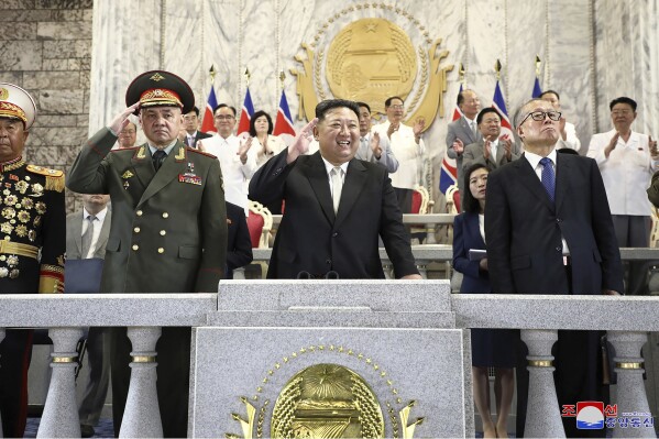 In this photo provided by the North Korean government, North Korean leader Kim Jong Un, center, Russian Defense Minister Sergei Shoigu, left, and China's Vice Chairman of the standing committee of the country’s National People’s Congress Li Hongzhong, right, attend a military parade to mark the 70th anniversary of the armistice that halted fighting in the 1950-53 Korean War, on Kim Il Sung Square in Pyongyang, North Korea Thursday, July 27, 2023. Independent journalists were not given access to cover the event depicted in this image distributed by the North Korean government. The content of this image is as provided and cannot be independently verified. Korean language watermark on image as provided by source reads: "KCNA" which is the abbreviation for Korean Central News Agency. (Korean Central News Agency/Korea News Service via AP)
