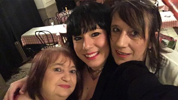 In this photo provided by Raquel Magalhaes, Viviane Bouculat, left, celebrates the New Year in 2018 with her friends Raquel Magalhaes, center, and Bernadette Marie. They jokingly called themselves "The Three Bad Girls." For three decades, Viviane Bouculat was the owner, cook and beating heart of l’Annexe. Anyone was welcome, but over the years it became a haven for local artists, actors and musicians. Bouculat died March 31, 2020 of coronavirus. She was 65.  (Raquel Magalhaes via AP)