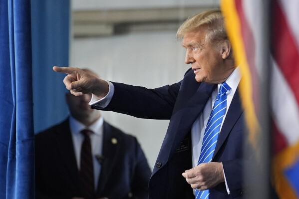 Republican presidential candidate former President Donald Trump motions before speaking at a campaign event Saturday, Jan. 27, 2024, in Las Vegas. (AP Photo/John Locher)