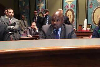 Sen. Elgie Sims, D-Chicago, discusses the proposed budget in a committee hearing in this Wednesday, May 30, 2018 photo, in Springfield, Ill. Sims on Tuesday, Oct. 26, 2021, won Illinois Senate approval of legislation to repeal a 1995 law requiring that a parent or guardian be notified at least 48 hours before a girl younger than 18 undergoes an abortion. The bill now moves to the House with two days left in the Illinois General Assembly's fall session. (AP Photo/John O'Connor)