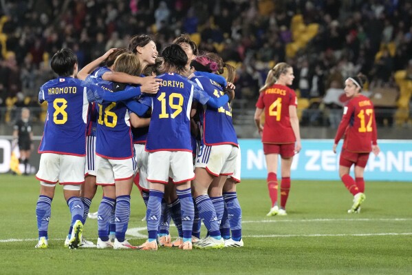 Japan's Mina Tanaka celebrates with teammates after scoring her side's 4th goal during the Women's World Cup Group C soccer match between Japan and Spain in Wellington, New Zealand, Monday, July 31, 2023. (AP Photo/John Cowpland)