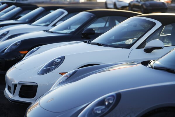 
              In this Sunday, Feb. 3, 2019, photograph, a long row of unsold 2019 911 Carrera GTS cabriolets sits at a Porsche dealership in Littleton, Colo. Borrowers are behind in their auto loan payments in numbers not seen since delinquencies peaked at the end of 2010, according to the Federal Reserve Bank of New York. (AP Photo/David Zalubowski)
            