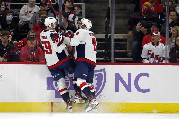 Washington Capitals' Aliaksei Protas (59) celebrates his goal with teammate Alex Ovechkin (8) during the second period of an NHL hockey game against the Carolina Hurricanes in Raleigh, N.C., Sunday, Nov. 28, 2021. (AP Photo/Karl B DeBlaker)