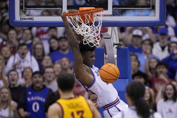 Kansas forward K.J. Adams Jr. (24) dunks the ball during the second half of an NCAA college basketball game against Iowa State Saturday, Jan. 14, 2023, in Lawrence, Kan. Kansas won 62-60 (AP Photo/Charlie Riedel)