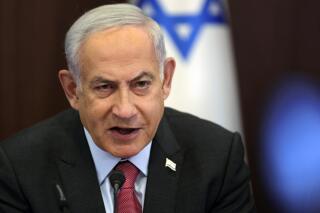 FILE - Israeli Prime Minister Benjamin Netanyahu attends a weekly cabinet meeting at the prime minister's office in Jerusalem on March 19, 2023. Netanyahu on Wednesday, March 29, rebuffed President Joe Biden's suggestion that the premier “walks away” from a contentious plan to overhaul the legal system, saying the country makes its own decisions. (Abir Sultan/Pool Photo via AP, File)
