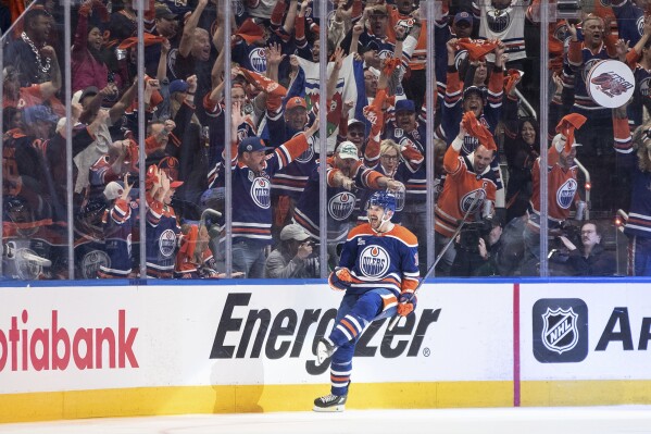 Edmonton Oilers' Zach Hyman celebrates after a goal against the Dallas Stars during the third period of Game 3 of the NHL hockey Stanley Cup Western Conference finals in Edmonton, Alberta, Sunday, May 25, 2025. (Jason Franson/The Canadian Press via AP)