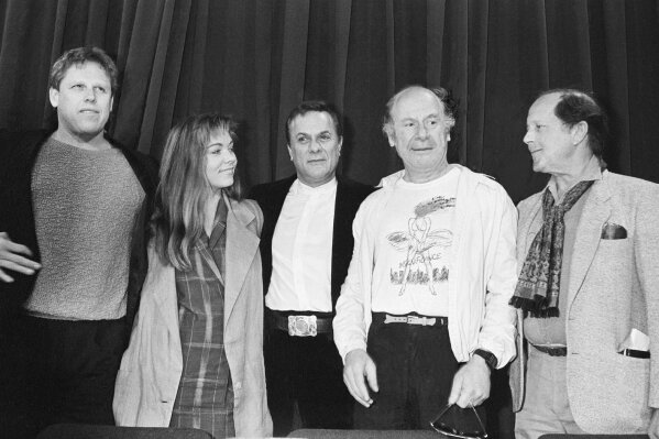 
              FILE - In this May 11 1985 file photo, from left, actors Gary Busey, Theresa Russell, Tony Curtis, Michael Emil, and director Nicolas Roeg answer newsmen during a press conference for "Insignificance" at the 38th Cannes International Film Festival, held in the festival palace for their film in competition, in Cannes. The son of Nicolas Roeg says the prominent British film director has died. He was 90. Nicolas Roeg Jr. told Britain's Press Association that the director of "The Man Who Fell to Earth" and "Don't Look Now" died Friday, Nov 23, 2018. (AP Photo/Michel Lipchitz, file)
            