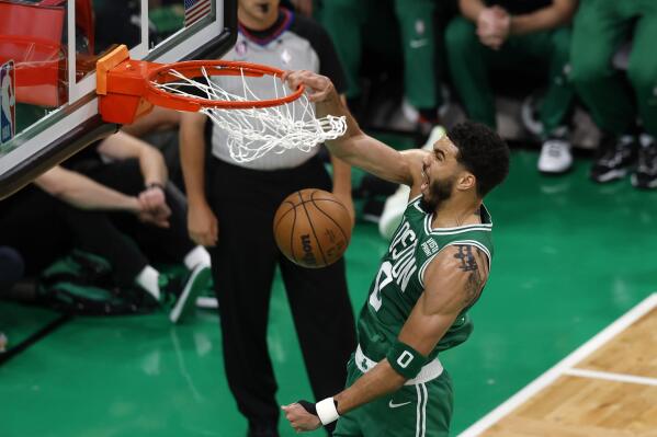 Boston Celtics forward Jayson Tatum dunks during the first half in Game 5 of the NBA basketball Eastern Conference finals against the Miami Heat Thursday, May 25, 2023, in Boston. (AP Photo/Michael Dwyer)