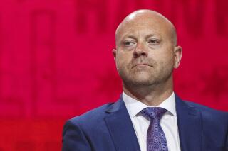 FILE - In this July 26, 2019, file photo, Chicago Blackhawks senior vice president and general manager Stan Bowman attends the NHL hockey team's convention in Chicago. Bowman has pledged to participate in and cooperate with an investigation into allegations that a former Chicago Blackhawks assistant coach sexually assaulted two players in 2010.  (AP Photo/Amr Alfiky, File)