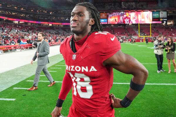 Arizona Cardinals wide receiver Marvin Harrison Jr. (18) celebrates with teammates during their NFL football game against the San Francisco 49ers on Jan. 5, 2025, in Glendale, Ariz. (AP Photo/Darryl Webb, File)