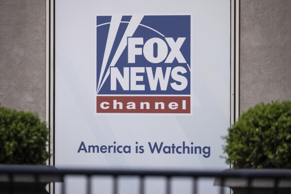 FILE - The Fox News logo is displayed outside Fox News Headquarters in New York, April 12, 2023. A former Donald Trump supporter who became the center of a conspiracy theory about Jan. 6, 2021, filed a defamation lawsuit against Fox News on Wednesday, July 12, saying the network made him a scapegoat for the Capitol insurrection. (AP Photo/Yuki Iwamura, File)