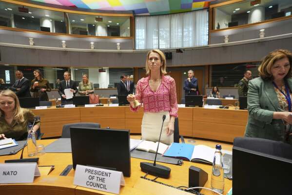 European Union foreign policy chief Kaja Kallas, center, rings a bell to signify the start of a meeting of EU defense ministers at the European Council building in Brussels, Tuesday, May 20, 2025. (AP Photo/Virginia Mayo)