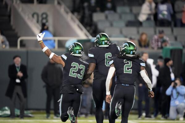 Tulane safety Lummie Young IV (23) celebrates his interception with linebacker Jimmy Phillips Jr. (6) and safety Isaiah Nwokobia (2) during the second half of an NCAA college football game against Southern Methodist in New Orleans, Thursday, Nov. 17, 2022. Tulane won 59-24. (AP Photo/Gerald Herbert)
