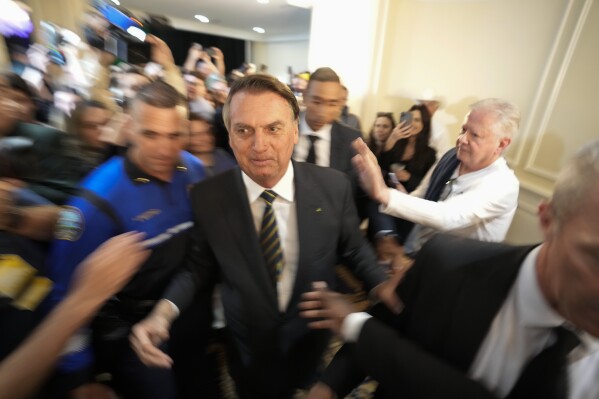 FILE - Brazil's former President Jair Bolsonaro leaves after attending an event at the Trump National Doral Miami, in Doral, Fla., Feb. 3, 2023. As Bolsonaro's term wound down in the final days of December 2022, Bolsonaro decided to skip the ritual of handing over the presidential sash to his successor, and instead traveled to Florida. (AP Photo/Rebecca Blackwell, File)