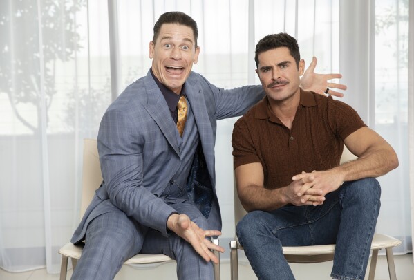 John Cena, left, and Zac Efron pose for a portrait to promote their film "Ricky Stanicky" on Tuesday, Feb. 13, 2024, in Los Angeles. (Photo by Rebecca Cabage/Invision/AP)
