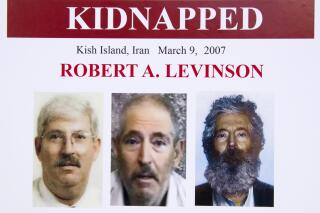 FILE - In this March 6, 2012, file photo, an FBI poster showing a composite image of former FBI agent Robert Levinson, right, of how he would look like now after five years in captivity, and an image, center, taken from the video, released by his kidnappers, and a picture before he was kidnapped, left, displayed during a news conference in Washington. A federal judge has held Iran responsible for the kidnapping of former FBI agent Robert Levinson. U.S. District Judge Timothy Kelly entered a default judgement against the regime on the 13th anniversary on his disappearance. (AP Photo/Manuel Balce Ceneta, File)