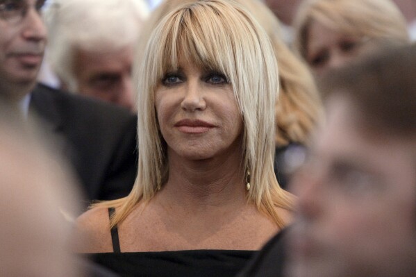 FILE - Suzanne Somers is seen during the funeral services for Merv Griffin at the Church of the Good Shepherd in Beverly Hills, Calif., Aug. 17, 2007. Somers, the effervescent blonde actor known for playing Chrissy Snow on the television show “Three’s Company,” as well as her business endeavors, died early Sunday, Oct. 15, 2023, her family said in a statement provided by her longtime publicist R. Couri Hay. She was 76. (AP Photo/Kevork Djansezian, Pool, File)