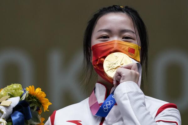Yang Qian, of China, reacts after winning the gold medal in the women's 10-meter air rifle at the Asaka Shooting Range in the 2020 Summer Olympics, Saturday, July 24, 2021, in Tokyo, Japan. (AP Photo/Alex Brandon)