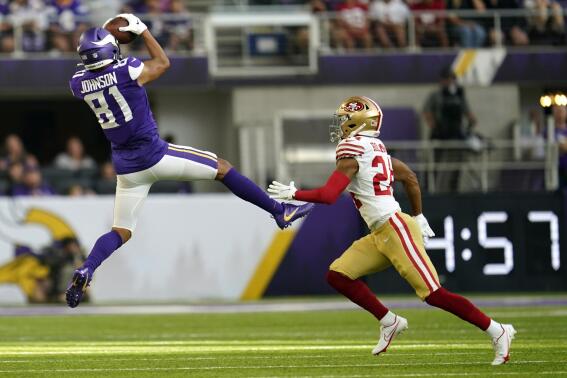 Minnesota Vikings wide receiver Bisi Johnson (81) catches a pass over San Francisco 49ers cornerback Ka'dar Hollman (24) during the first half of a preseason NFL football game, Saturday, Aug. 20, 2022, in Minneapolis. (AP Photo/Abbie Parr)