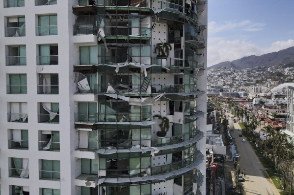 Damaged buildings stand after Hurricane Otis ripped through Acapulco, Mexico, Thursday, Oct. 26, 2023. The hurricane that strengthened swiftly before slamming into the coast early Wednesday as a Category 5 storm has killed at least 27 people as it devastated Mexico's resort city of Acapulco. (AP Photo/Felix Marquez)