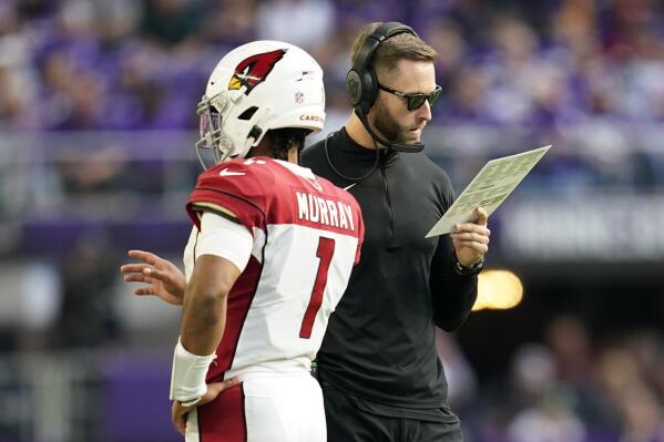 Arizona Cardinals head coach Kliff Kingsbury talks with quarterback Kyler Murray (1) during the second half of an NFL football game against the Minnesota Vikings, Sunday, Oct. 30, 2022, in Minneapolis. (AP Photo/Abbie Parr)