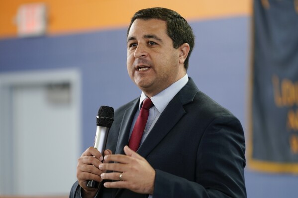 FILE - Wisconsin Attorney General Josh Kaul speaks at a campaign stop on Oct. 27, 2022, in Milwaukee. Two groups of investigative journalists tracking police misconduct have filed a lawsuit in the hopes of forcing the Wisconsin Department of Justice to divulge the names, birthdates and disciplinary records of every officer in the state. (AP Photo/Morry Gash, File)